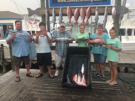 Family with their catch at Zeke's Landing