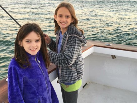 Two young girls aboard the Wild Orange